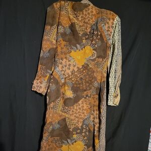 Step into timeless elegance with this stunning vintage 80s dress in rich browns.